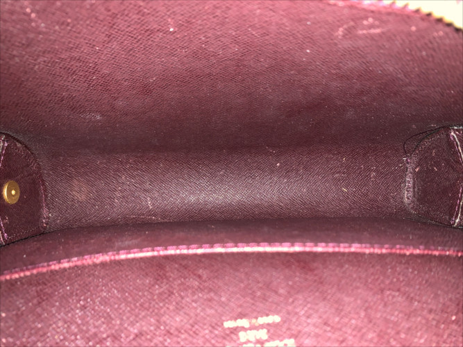 LOUIS VUITTON POCHETTE BAIKAL CLUTCH AUS TAIGA LEDER IN ACAJOU
