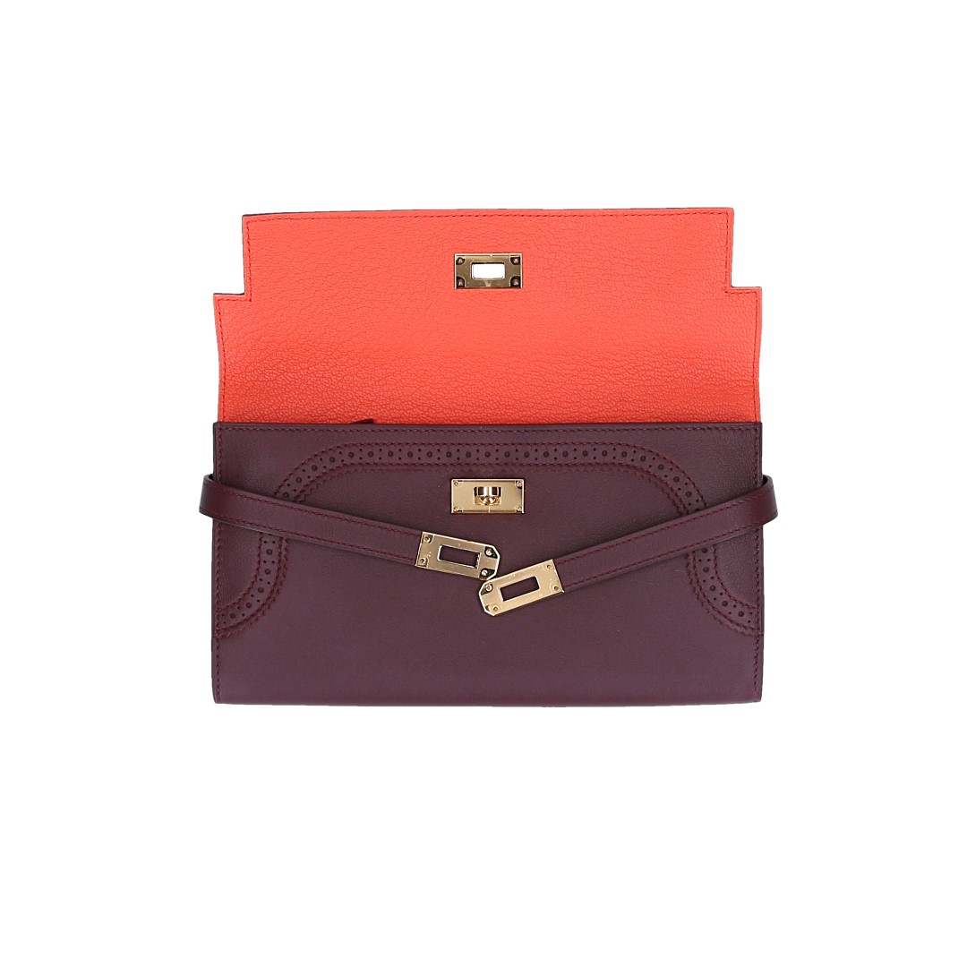 HERMÈS BRIEFTASCHE KELLY CLASSIQUE AUS VEAU GHILLIES SWIFT IN PRUNE/POPPY ORANGE MIT GHW