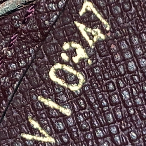 LOUIS VUITTON POCHETTE BAIKAL CLUTCH AUS TAIGA LEDER IN ACAJOU