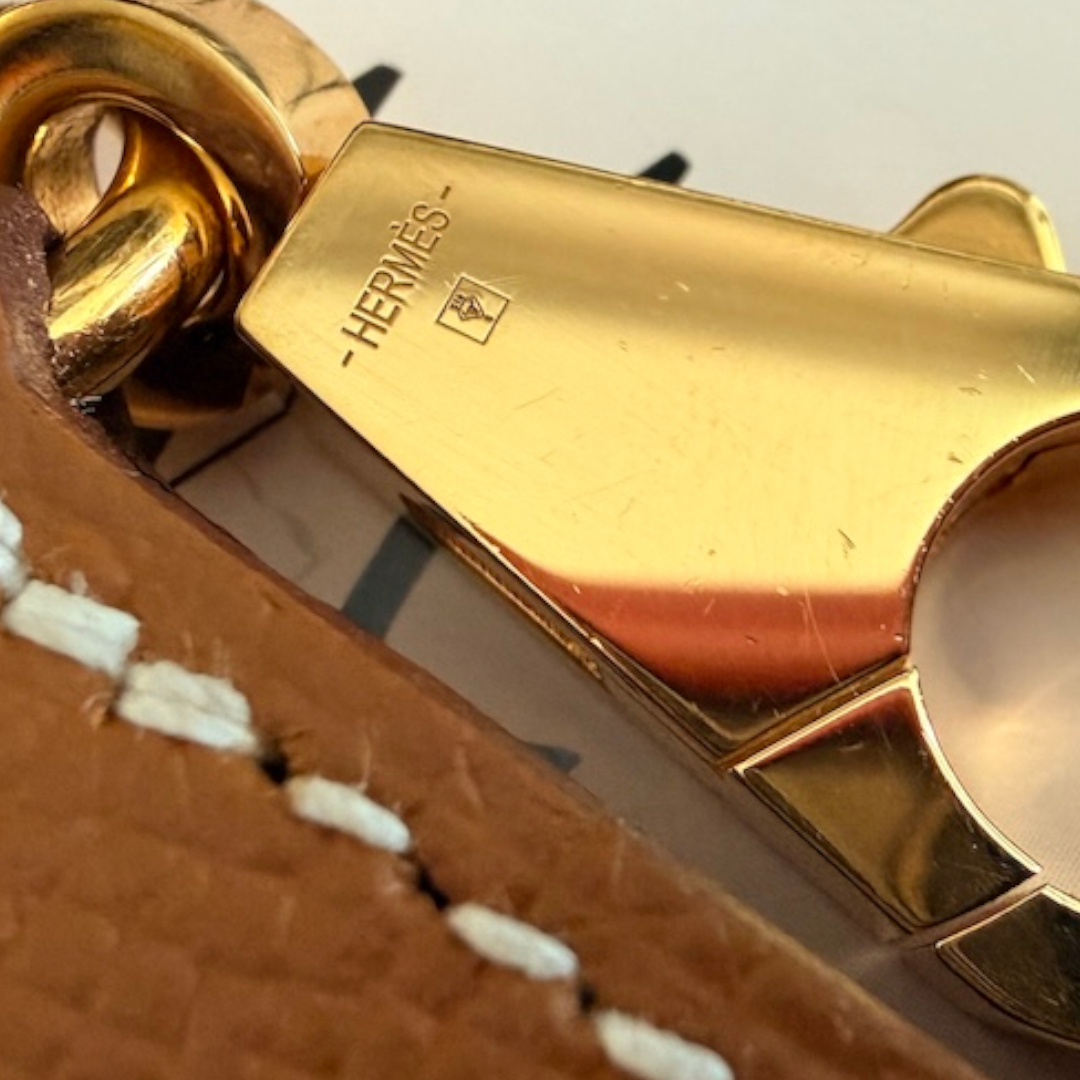 HERMÈS SHOULDER STRAP 'ZIGZAG' MADE OF SWIFT CALF LEATHER AND TEXTILE IN GOLD/WHITE/GOLD WITH GHW